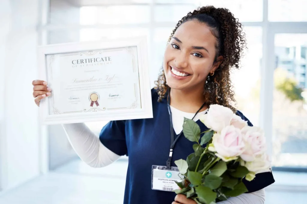 happy woman holding a certificate and flowers