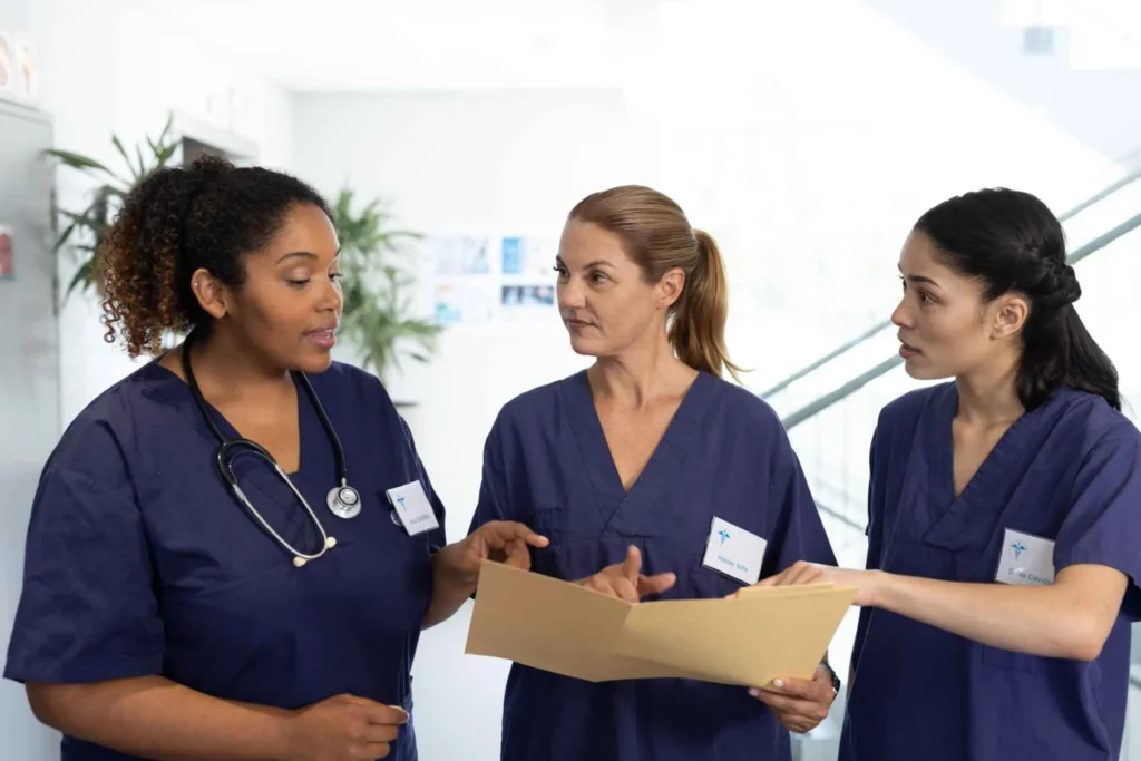 group of nurses talking in the lobby