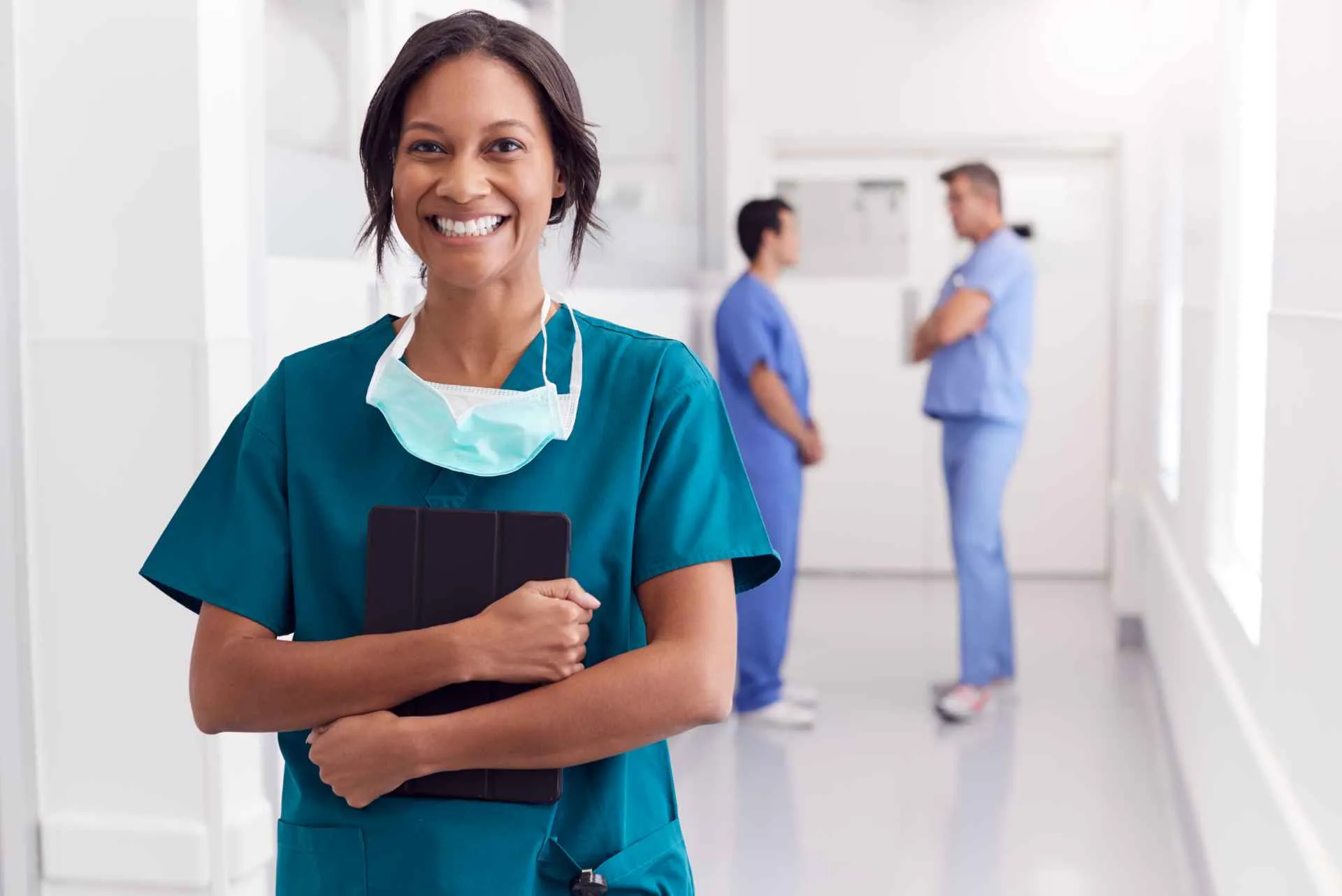 happy female nurse outside the clinic